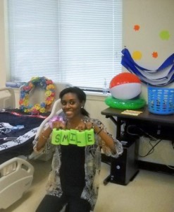 A CTC student prepares for an indoor pool party by setting up games.