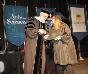 Chattahoochee Technical College President Dr. Ron Newcomb congratulates Krista Colling of Kennesaw during commencement.