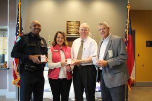 Pictured, from left, are Chattahoochee Tech Director for Alumni and Annual Giving Stephanie Hubbell, Chattahoochee Tech Chief of Police Charles Spann, Acworth Police Chief Wayne Dennard and Ben Flanagan with Lacey Drug Company.