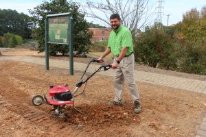 CTC Instructor with garden tiller.