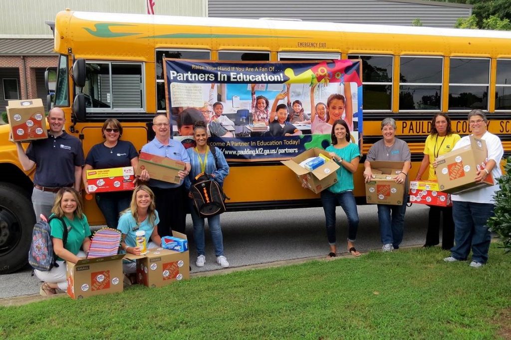 Chattahoochee Tech volunteers for this initiative included, standing from left to right, Nate Beardsley, Frances Carlson, Barry Munday, Cynthia Brown, Leigh Foster, Tina Lancaster, Lori Fields and Brenda White, and kneeling from left to right, Stephanie Hubbell and Missy Cusack.