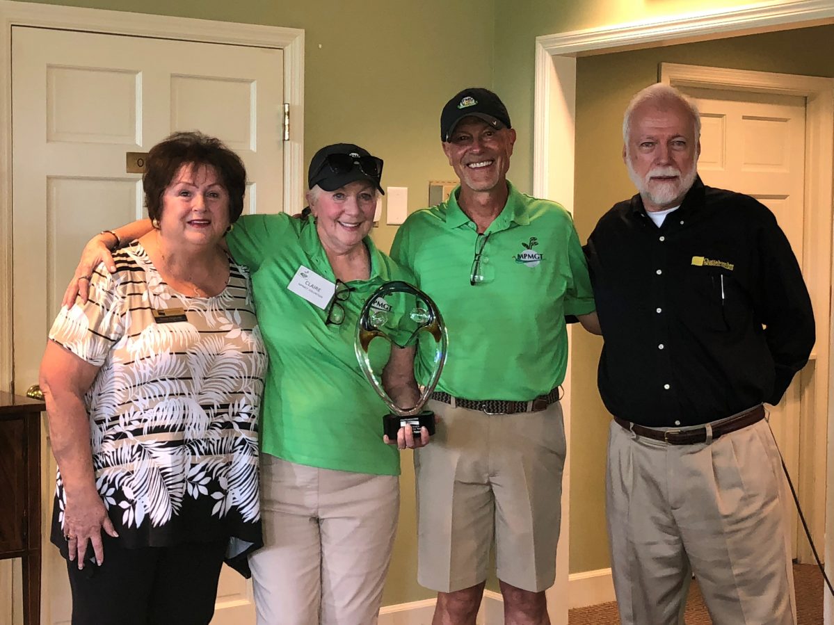Chattahoochee Tech presents the Volunteer of the Year award to Alan and Claire Peterson.
