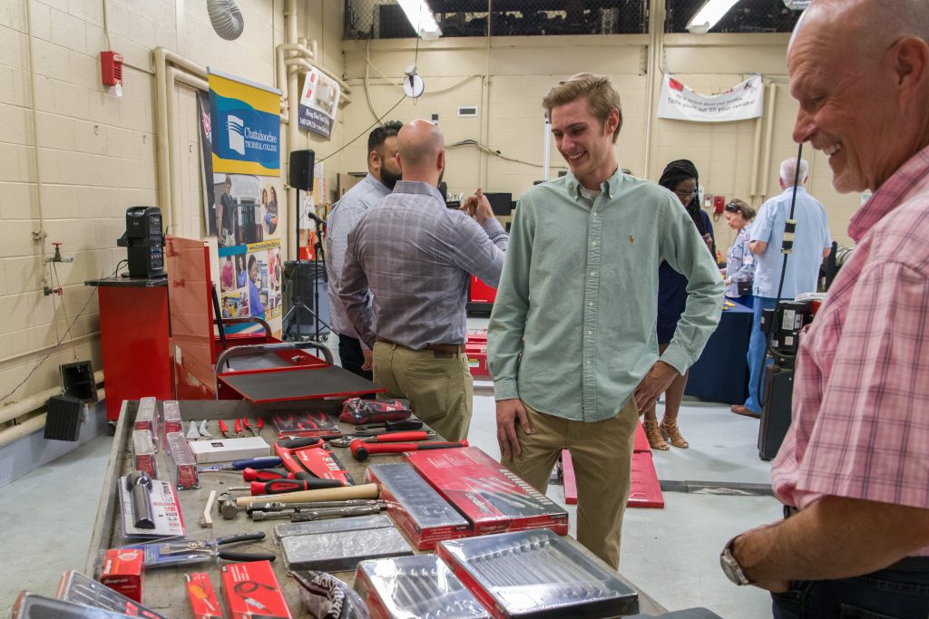 Award winner Stuart Seiler admires the Snap-on tool set with Alan Peterson.