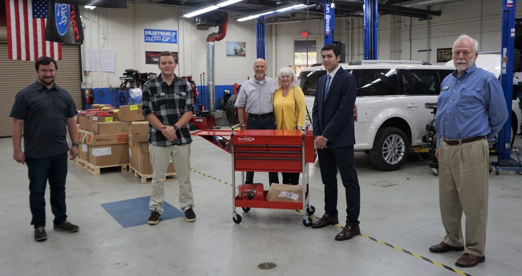 Justin Messenger and Alex Johnson receive tool sets.