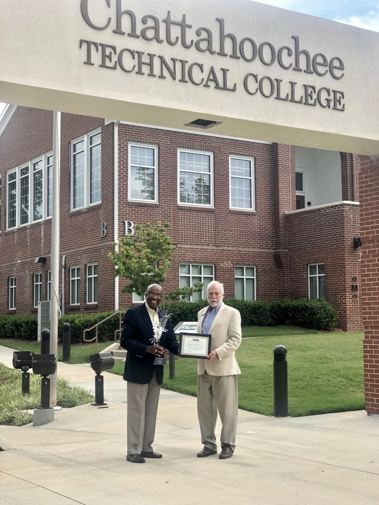 Retiring Board Member Rev. Carl A. Moore and Dr. Ron Newcomb