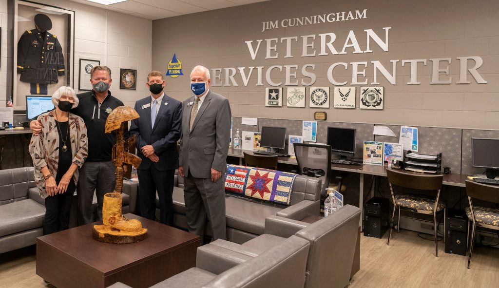 Shown here are Jan Cunningham, TCSG State Board Member Jay Cunningham, TCSG Commissioner Greg Dozier, and Chattahoochee Tech President Dr. Ron Newcomb.