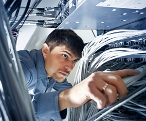 Man working with computer wires
