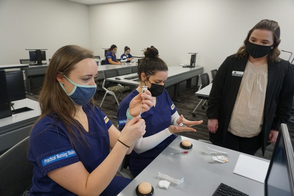 Shown here, l-r, are Chattahoochee Tech Practical Nursing program students Samantha “Sam” Vernon and Monica Briggs with Chatt Tech Nursing Instructor Ayla Roberts.