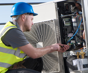 Man working with air conditioner