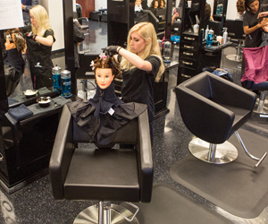 Woman cutting a mock hair