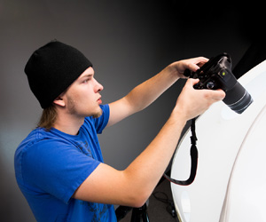 A student using a photography camera