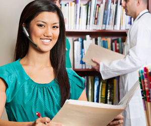 A woman smiling at a doctor's office