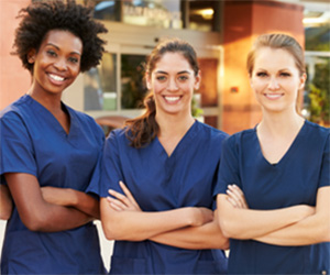 Three smiling nurses