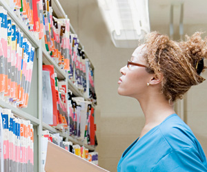 Woman looking at files