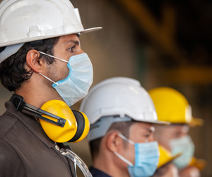 Men wearing hardhats and masks