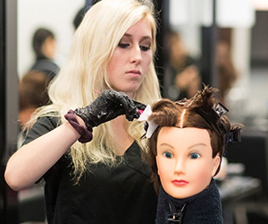 A woman cutting mock hair