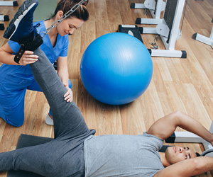 Physical Therapist working with a client