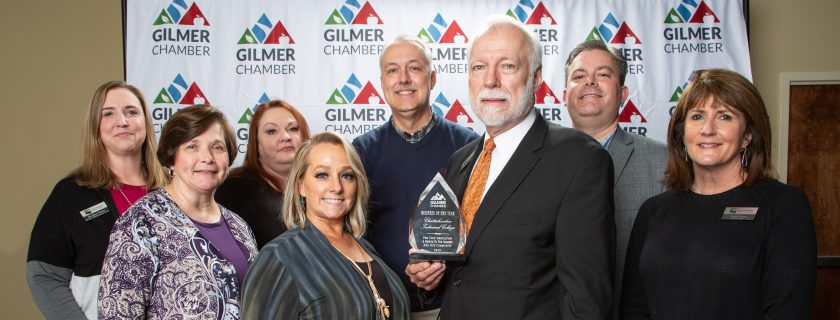 Group of people holding award