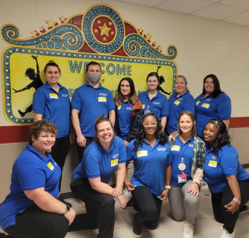 Chattahoochee Tech students in the college's Occupational Therapy Assistant program are shown here with OTA Program Director and Lead Instructor Amy Shaffer, front row on left. In the top photo, Chatt Tech OTA student Monica Kantor is shown reading to a group of elementary school students.