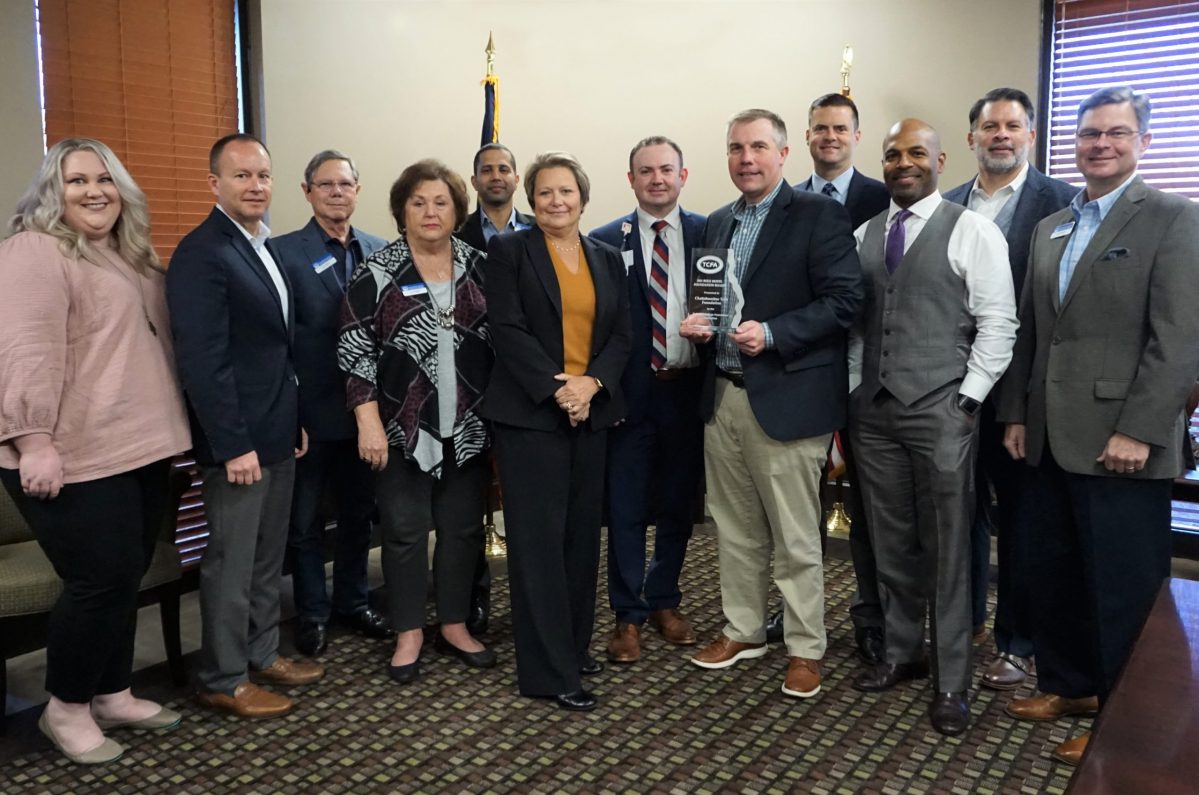 12 men and women, Foundation Board of Trustees, receiving Role Model Board Award