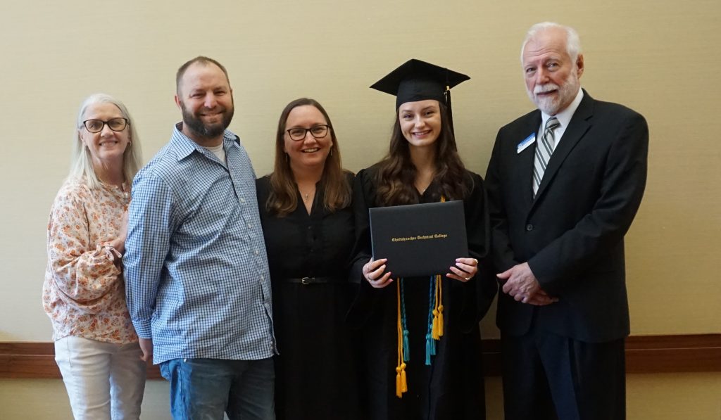 Dual Enrollment graduate Lauren Gibbs is shown here with her family and Dr. Ron Newcomb