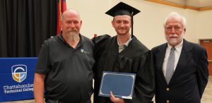 Chattahoochee Tech employee Bradley Scott Proctor, center, is shown here with his father, Scott, and Dr. Ron Newcomb.