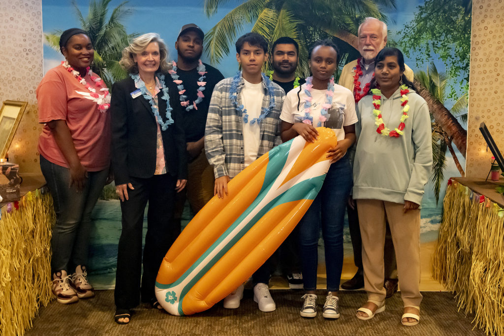 Student volunteers at the Reverse Raffle pose with Dr. Newcomb and Board of Directors Chair