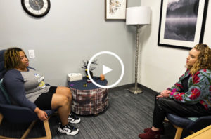 A student sitting down in a comfortable room and receiving counseling services from one of Chattahoochee's licensed counselors