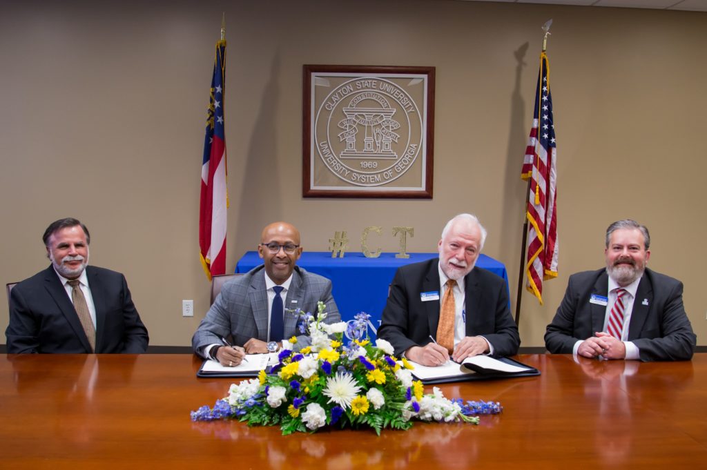 Chatt Tech President Dr. Ron Newcomb and Executive VP Jason Tanner are shown here at the signing table with Clayton State President Dr. Georgj Lewis and Clayton State VP for Academic Affairs Kevin Demmitt.