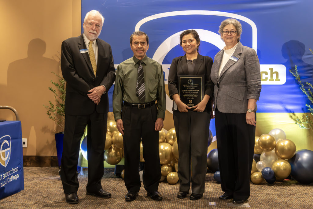 2024 EAGLE winner is shown on stage with family and Dr. Ron Newcomb and Chatt Tech Director of Adult Education Chris Hord.