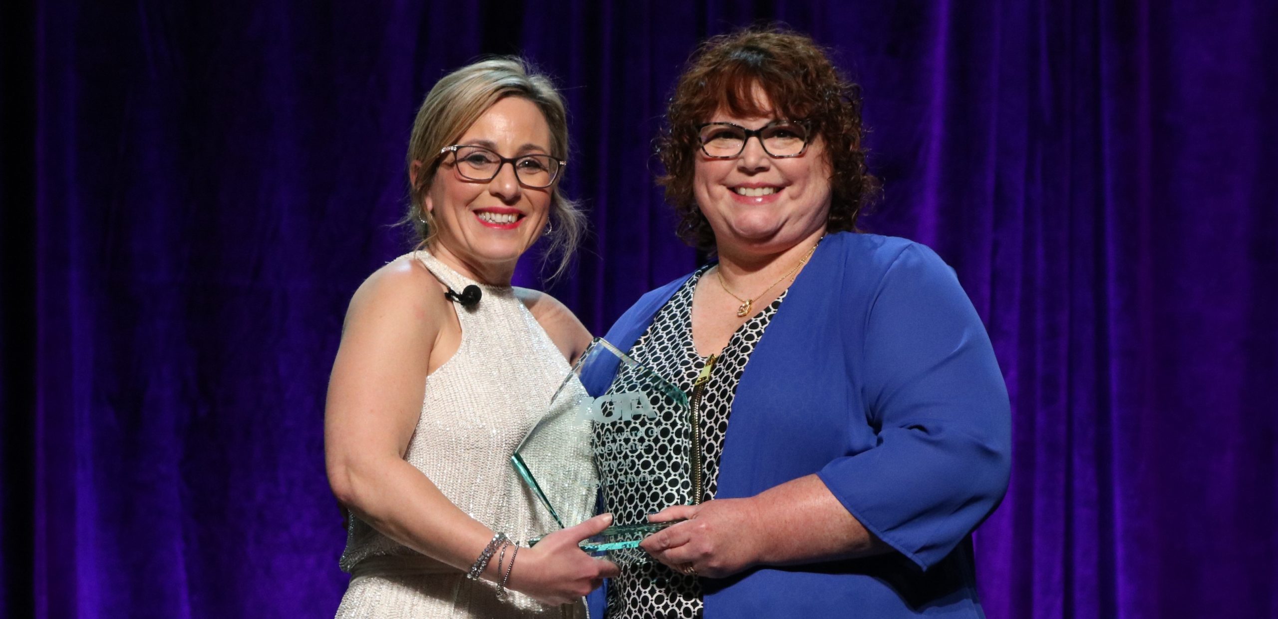 OATA President Alyson Stover presents the national OTA Award of Excellence to Dr. Amy Shaffer of Chattahoochee Tech