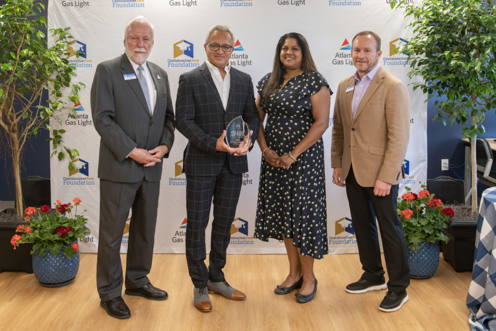 Dr. Anil Yadav was presented with the 2024 SPARK Workforce Benefactor of the Year award. Shown here, l-r, are Chattahoochee Tech President Dr. Ron Newcomb, Dr. Anil Yadav, Dr. Monika Yadav, and Board of Trustees Chair Rick Kollhoff.