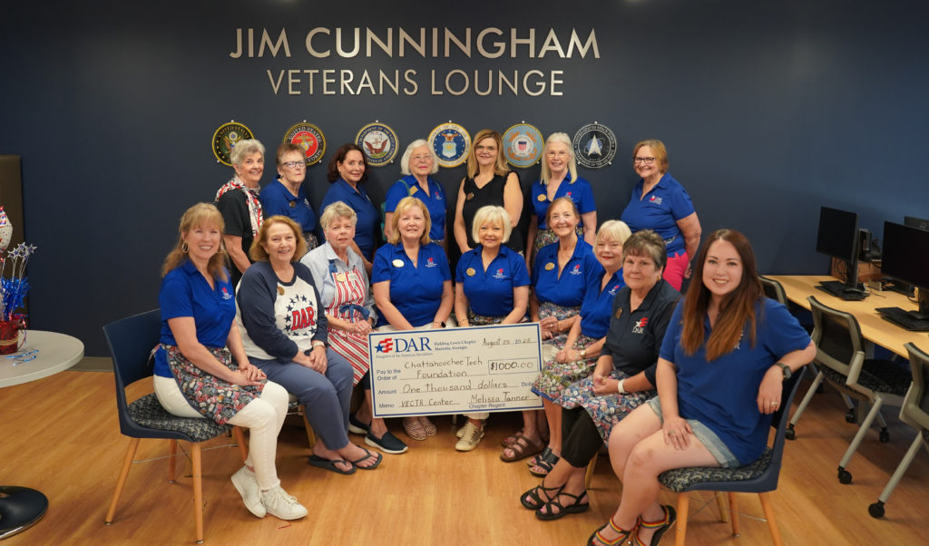 Group of 16 volunteers from the Fielding Lewis DAR Chapter are shown here with donation check.