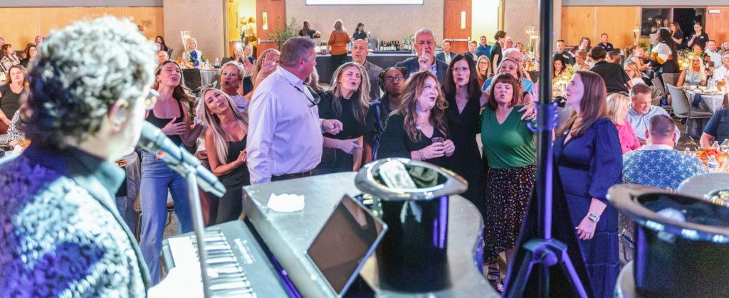 The audience is shown here at the Dueling Pianos performance.