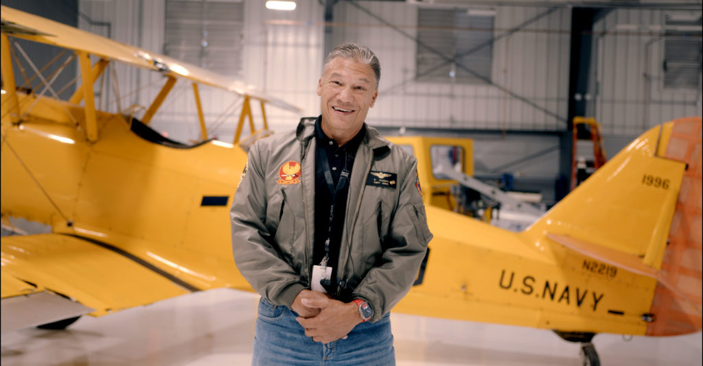 Chatt Tech Instructor Conrad Rucker stands in front of the N3N plane at Chatt Tech