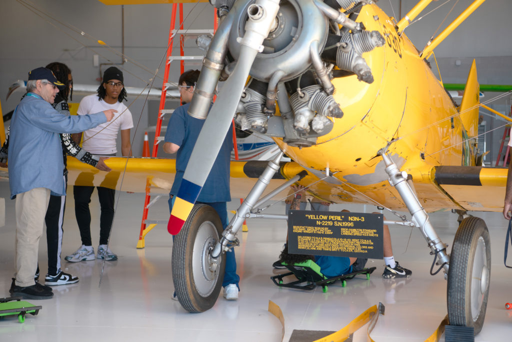 Chatt Tech students and instructor prepare to work on the N3N wing